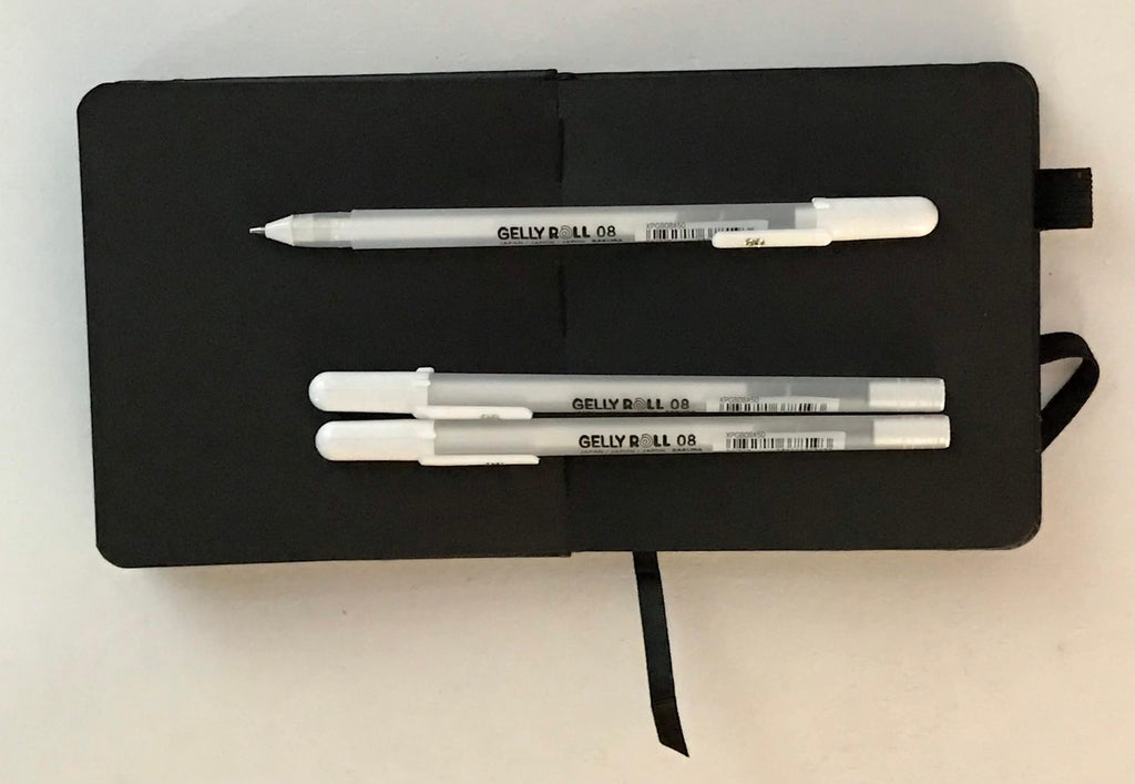 Sakura square black sketchbook and 3 White Medium 08 Gelly roll pens