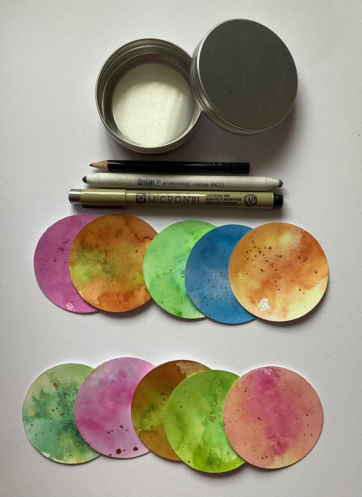 Round aluminium tin with x10 2.5” watercolour artist trading coins
