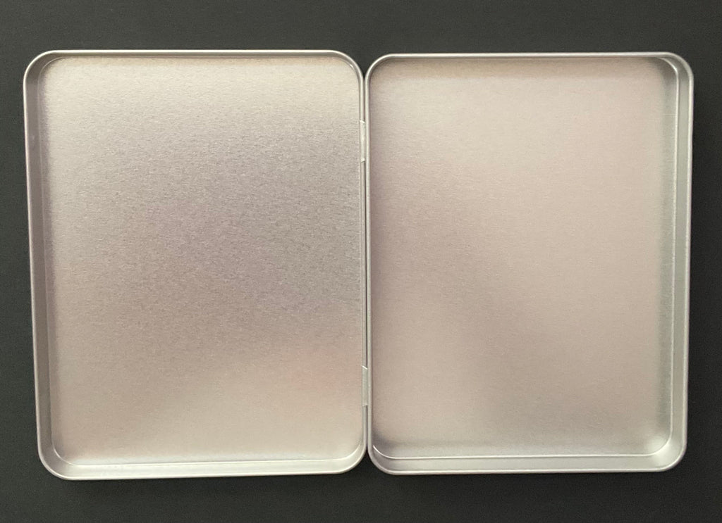 Silver coloured rectangular shaped tin with hinge lid for stationery