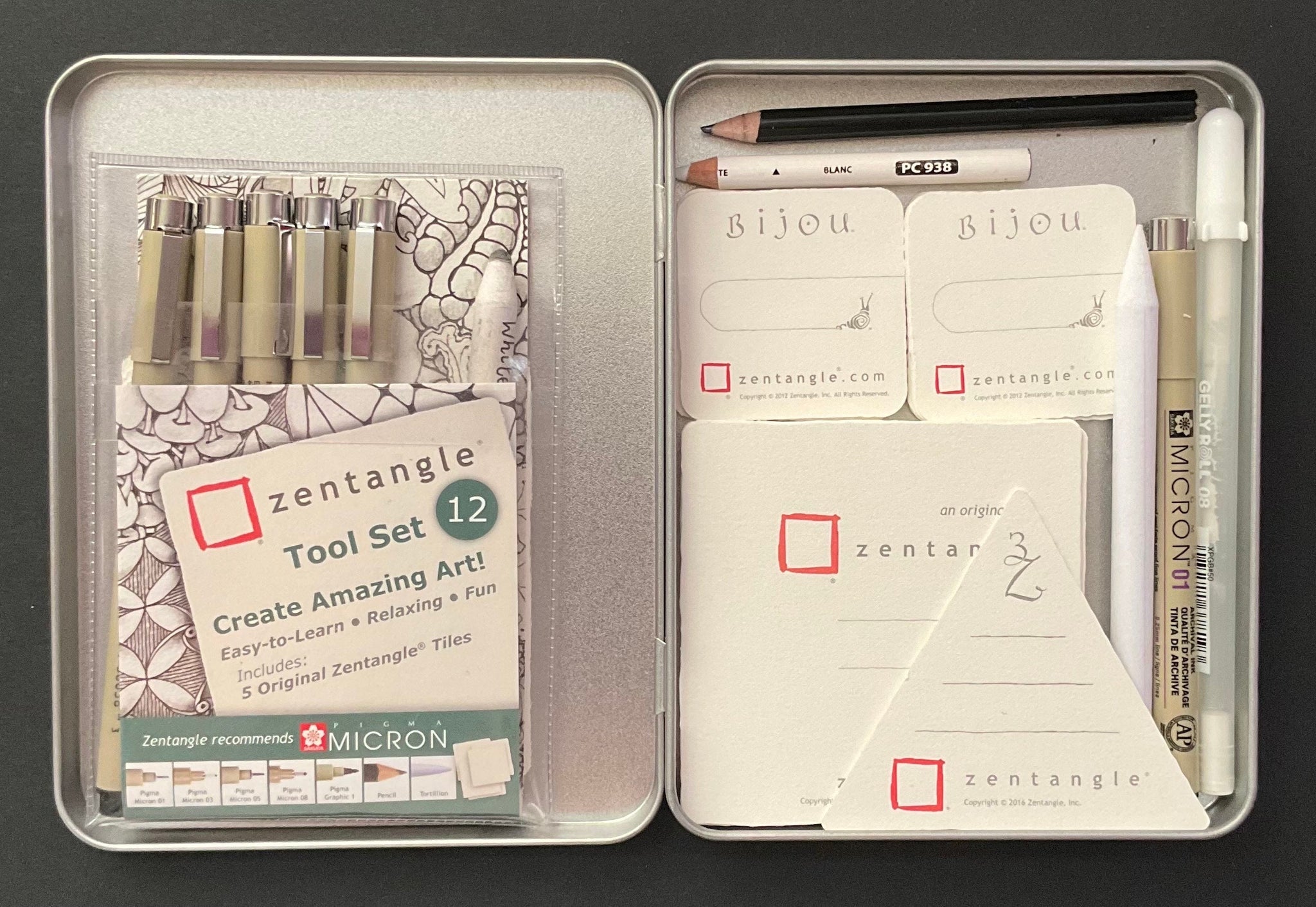 Silver coloured rectangular stationery tin and 12 piece