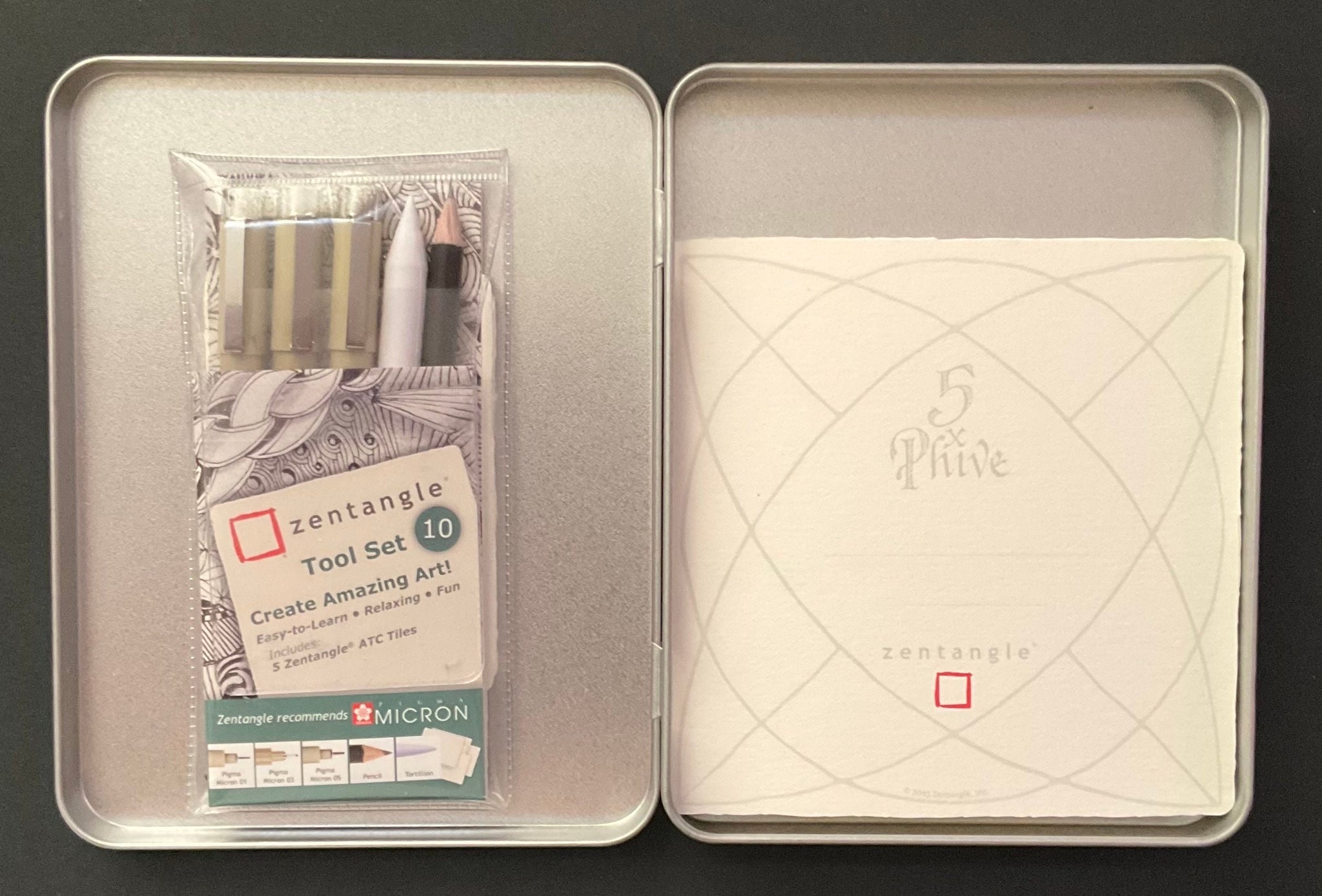 Silver coloured rectangular stationery tin and 12 piece Zentangle