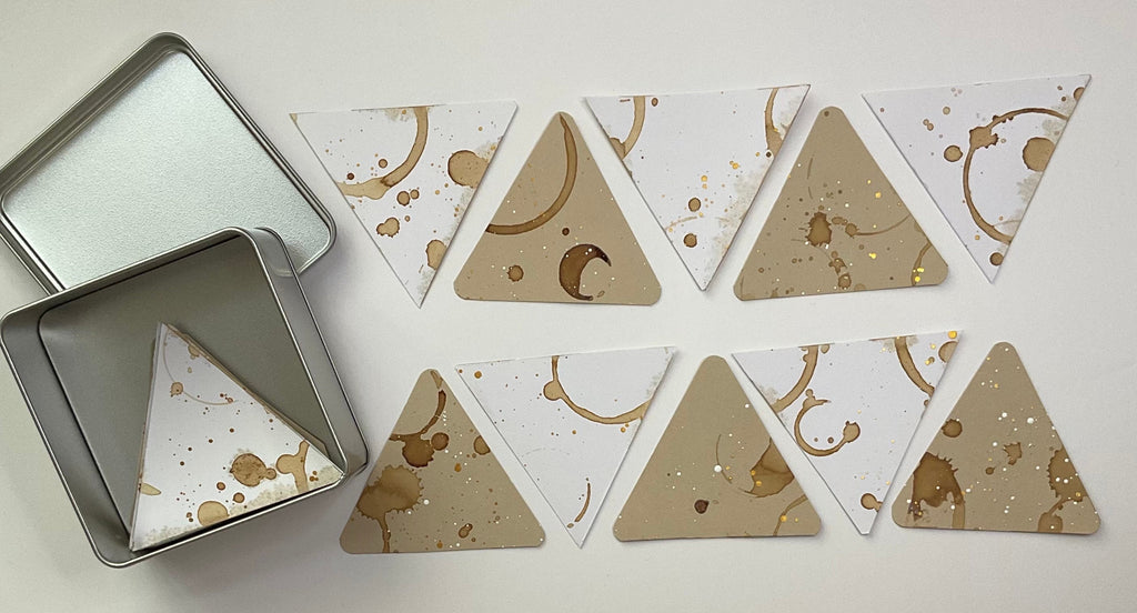 Square tin and x10 coffee stained triangle shaped Tiles